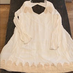 White dress with lace details.